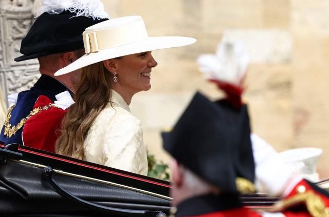 Britain's Prince William, Prince of Wales (L) and Britain's Catherine, Princess of Wales leave after the Order of the Garter service at St. George's Chapel in Windsor Castle, west of London, on June 15, 2026. The Order of the Garter is the oldest and most senior Order of Chivalry in Britain, established by King Edward III nearly 700 years ago. (Photo by Henry NICHOLLS / POOL / AFP)