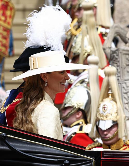 Britain's Prince William, Prince of Wales (L) and Britain's Catherine, Princess of Wales leave after the Order of the Garter service at St. George's Chapel in Windsor Castle, west of London, on June 15, 2026. The Order of the Garter is the oldest and most senior Order of Chivalry in Britain, established by King Edward III nearly 700 years ago. (Photo by Henry NICHOLLS / POOL / AFP)