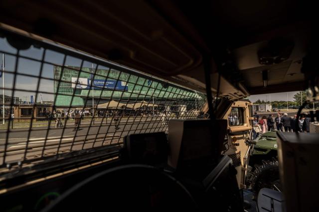 This photograph shows a view of an exhibition hall through the front window of a military vehicle displayed at the Eurosatory land and airland defence andsecurity trade fair, at the Paris-Nord Villepinte Exhibition Centre in Villepinte, north of Paris on June 15, 2026. Twelve Israeli stands were closed at the Eurosatory defence and security exhibition, which opened on today, for failing to comply with the conditions that had been set, according to a statement received by AFP from the organising company, Coges Events. (Photo by Guillaume BAPTISTE / AFP)