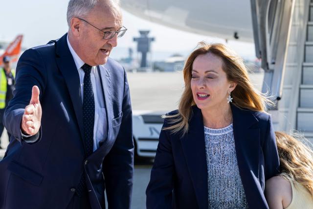 Switzerland's President Guy Parmelin (L) welcomes Italy's Prime Minister Giorgia Meloni (R) as she arrives to attend the G7 summit, in Geneva on June 15, 2026. A G7 summit is set to take place June 15 to 17 in the French town of Evian-les-Bains near Switzerland and it will be attended by country leaders as well as the EU's foreign policy chief and ministers from Brazil, Canada, the United Arab Emirates and Turkey. (Photo by MARTIAL TREZZINI / POOL / AFP)