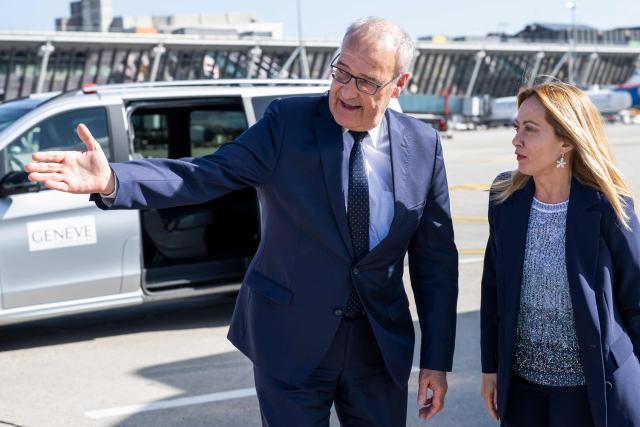 Switzerland's President Guy Parmelin (L) welcomes Italy's Prime Minister Giorgia Meloni (R) as she arrives to attend the G7 summit, in Geneva on June 15, 2026. A G7 summit is set to take place June 15 to 17 in the French town of Evian-les-Bains near Switzerland and it will be attended by country leaders as well as the EU's foreign policy chief and ministers from Brazil, Canada, the United Arab Emirates and Turkey. (Photo by MARTIAL TREZZINI / POOL / AFP)