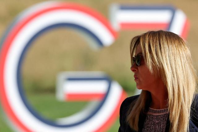 Italy's Prime Minister Giorgia Meloni arrives for the G7 summit, in Evian, central-eastern France on June 15, 2026. A G7 summit is set to take place June 15 to 17 in the French town of Evian-les-Bains near Switzerland and it will be attended by country leaders as well as the EU's foreign policy chief and ministers from Brazil, Canada, the United Arab Emirates and Turkey. (Photo by Christian Hartmann / POOL / AFP)