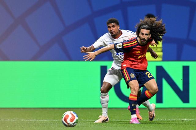 Cape Verde's midfielder #14 Deroy Duarte (L) and Spain's defender #24 Marc Cucurella (R) fight for the ball during the 2026 World Cup Group H football match between Spain and Cape Verde at the Atlanta Stadium in Atlanta on June 15, 2026.  (Photo by Roberto SCHMIDT / AFP)
