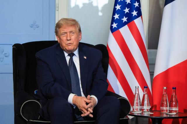 US President Donald Trump speaks during a bilateral meeting with France's President on the sidelines of the G7 summit, in Evian, central-eastern France on June 15, 2026. A G7 summit is set to take place June 15 to 17 in the French town of Evian-les-Bains near Switzerland and it will be attended by country leaders as well as the EU's foreign policy chief and ministers from Brazil, Canada, the United Arab Emirates and Turkey. (Photo by Ludovic MARIN / POOL / AFP)