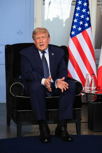 US President Donald Trump speaks during a bilateral meeting with France's President on the sidelines of the G7 summit, in Evian, central-eastern France on June 15, 2026. A G7 summit is set to take place June 15 to 17 in the French town of Evian-les-Bains near Switzerland and it will be attended by country leaders as well as the EU's foreign policy chief and ministers from Brazil, Canada, the United Arab Emirates and Turkey. (Photo by Ludovic MARIN / POOL / AFP)