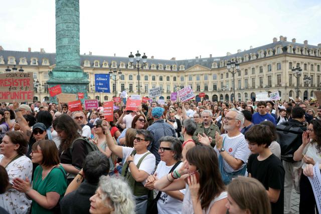 Protestors take part in a gathering to demand a law against violence on minors, outside the French Justice Ministry, in Place Vendome, in Paris on June 15, 2026. (Photo by Thomas SAMSON / AFP)