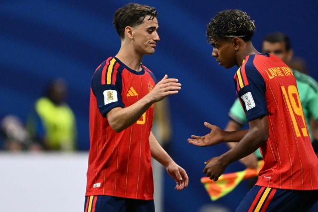 Spain's midfielder #09 Gavi (L) and Spain's forward #19 Lamine Yamal (R) shake hands during a substitution during the 2026 World Cup Group H football match between Spain and Cape Verde at the Atlanta Stadium in Atlanta on June 15, 2026.  (Photo by Roberto SCHMIDT / AFP)