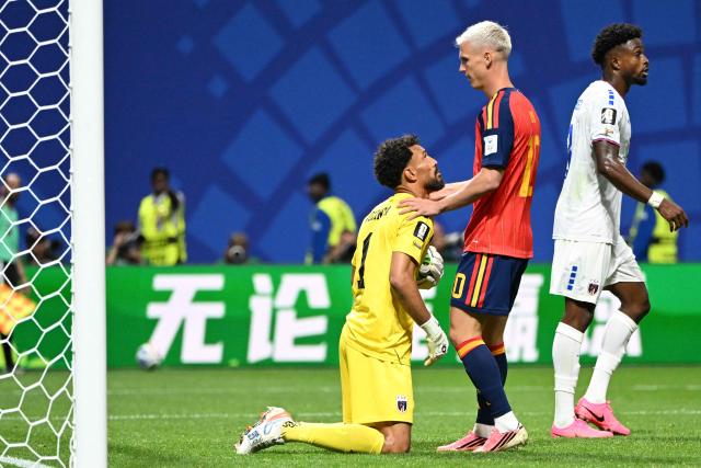 Cape Verde's goalkeeper #01 Vozinha (C) and Spain's forward #10 Dani Olmo (2ndR) apologize after a contact during the 2026 World Cup Group H football match between Spain and Cape Verde at the Atlanta Stadium in Atlanta on June 15, 2026.  (Photo by ROBERTO SCHMIDT / AFP)