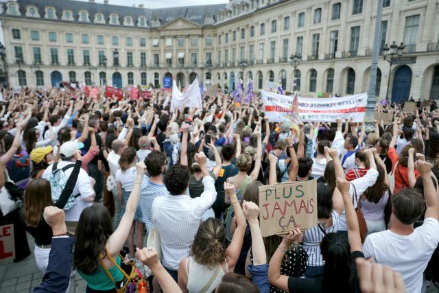 Protestors gather to demand a law against violence on minors, outside the French Justice Ministry, in Place Vendome, in Paris on June 15, 2026. (Photo by Thomas SAMSON / AFP)