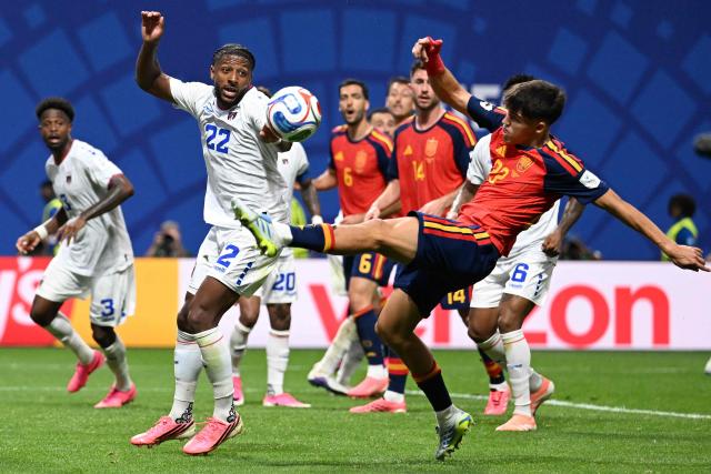 Spain's defender #22 Pau Cubarsi (R) misses the ball during the 2026 World Cup Group H football match between Spain and Cape Verde at the Atlanta Stadium in Atlanta on June 15, 2026.  (Photo by ROBERTO SCHMIDT / AFP)