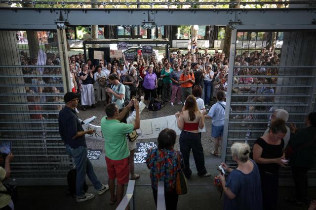 Protestors chant outside Toulouse courthouse to demand a law against violence towards minors following the death of 11-year Lyhanna, in Toulouse, on June 15, 2026. (Photo by Valentine CHAPUIS / AFP)