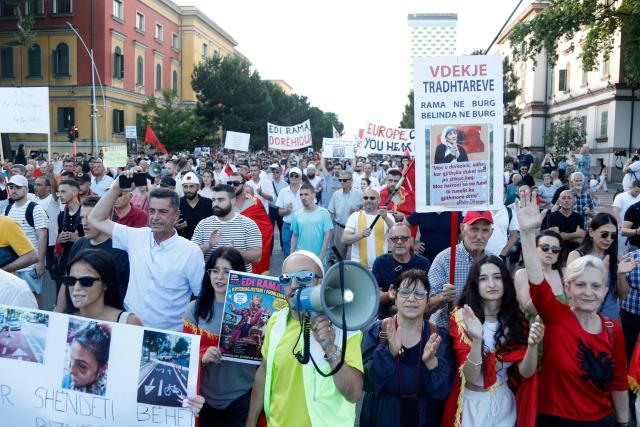 Protestors take part in a demonstration against the construction of a luxury resort near a protected natural area, as they gather in front of Albania's Prime Minister's Office in Tirana on June 15, 2026. Protests have swept Albania for more than two weeks over plans for a luxury hotel project in the protected coastal area of Zvernec, linked to US President Donald Trump's son-in-law Jared Kushner. (Photo by Adnan Beci / AFP)