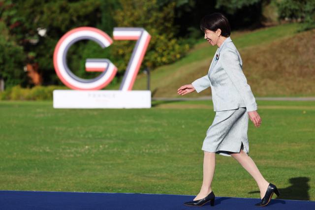 Japan's Prime Minister Sanae Takaichi arrives for the official greeting during the G7 summit, in Evian, eastern France, on June 15, 2026. A G7 summit is set to take place June 15 to 17 in the French town of Evian-les-Bains near Switzerland and it will be attended by country leaders as well as the EU's foreign policy chief and ministers from Brazil, Canada, the United Arab Emirates and Turkey. (Photo by Ludovic MARIN / AFP)