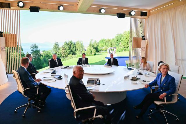 (LtoR) Germany's Chancellor Friedrich Merz, Britain's Prime Minister Keir Starmer, US President Donald Trump, European Council President Antonio Costa, France's President Emmanuel Macron, Canada's Prime Minister Mark Carney, Italy's Prime Minister Giorgia Meloni and European Commission President Ursula von der Leyen attend a working dinner with G7 leaders during the G7 summit in Evian, central-eastern France on June 15, 2026. A G7 summit is set to take place June 15 to 17 in the French town of Evian-les-Bains near Switzerland and it will be attended by country leaders as well as the EU's foreign policy chief and ministers from Brazil, Canada, the United Arab Emirates and Turkey. (Photo by Mandel NGAN / AFP)