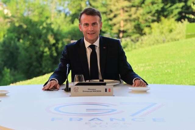 France's President Emmanuel Macron attends a working dinner with G7 leaders during the G7 summit in Evian, central-eastern France on June 15, 2026. A G7 summit is set to take place June 15 to 17 in the French town of Evian-les-Bains near Switzerland and it will be attended by country leaders as well as the EU's foreign policy chief and ministers from Brazil, Canada, the United Arab Emirates and Turkey. (Photo by Ludovic MARIN / AFP)