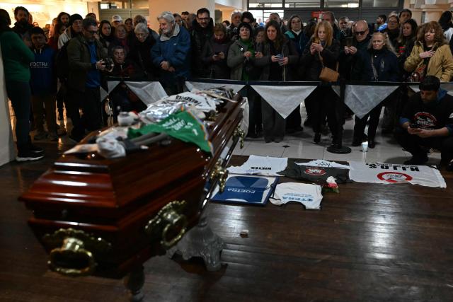 People attend the funeral of Taty Almeida, the late president of the Madres de Plaza de Mayo human rights association, at FOETRA union office in Buenos Aires, on June 15, 2026. Almeida died on June 14, 2026 at the age of 95, after more than four decades as one of the most prominent voices against the crimes of Argentina’s last dictatorship since she lost in 1975 her son Alejandro, a member of the guerrilla group Revolutionary People’s Army (ERP), kidnapped by the right-wing paramilitary organization Triple A.. (Photo by Luis ROBAYO / AFP)