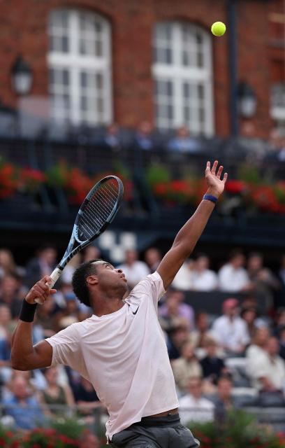 France's Giovanni Mpetshi Perricard serves singles round of 32 tennis match on day one of the ATP HSBC Championships at Queen's Club in west London on June 15, 2026. (Photo by Adrian DENNIS / AFP)