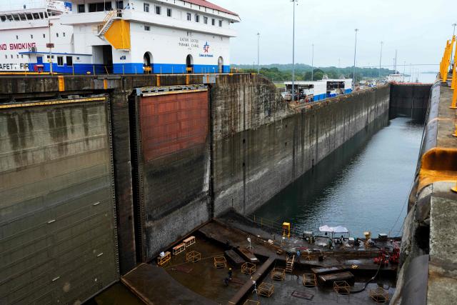 Panama Canal workers carry out routine maintenance inside one of the chambers at the Gatun Locks in the province of Colon, located about 80 kilometers north of Panama City, on June 15, 2026. These maintenance operations are carried out periodically across the interoceanic waterway to ensure the safe and efficient transit of vessels along one of the world's most important and heavily traveled maritime trade routes. (Photo by ARNULFO FRANCO / AFP)