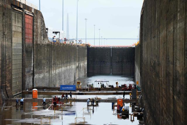Panama Canal workers carry out routine maintenance inside one of the chambers at the Gatun Locks in the province of Colon, located about 80 kilometers north of Panama City, on June 15, 2026. These maintenance operations are carried out periodically across the interoceanic waterway to ensure the safe and efficient transit of vessels along one of the world's most important and heavily traveled maritime trade routes. (Photo by ARNULFO FRANCO / AFP)