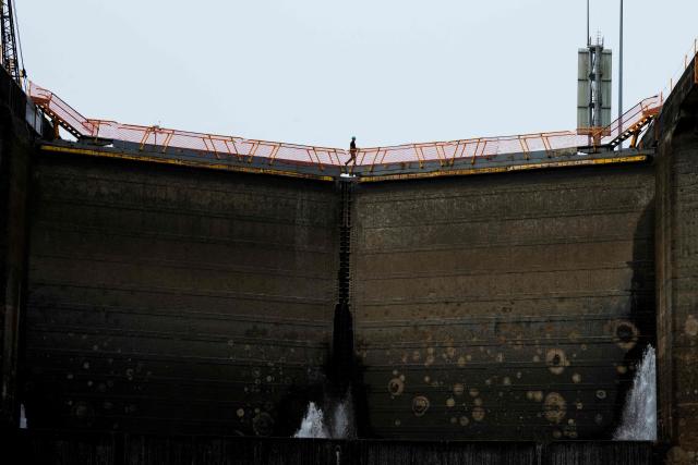 A Panama Canal worker carries out routine maintenance inside one of the chambers at the Gatun Locks in the province of Colon, located about 80 kilometers north of Panama City, on June 15, 2026. These maintenance operations are carried out periodically across the interoceanic waterway to ensure the safe and efficient transit of vessels along one of the world's most important and heavily traveled maritime trade routes. (Photo by ARNULFO FRANCO / AFP)
