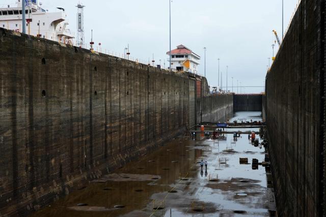 Panama Canal workers carry out routine maintenance inside one of the chambers at the Gatun Locks in the province of Colon, located about 80 kilometers north of Panama City, on June 15, 2026. These maintenance operations are carried out periodically across the interoceanic waterway to ensure the safe and efficient transit of vessels along one of the world's most important and heavily traveled maritime trade routes. (Photo by ARNULFO FRANCO / AFP)