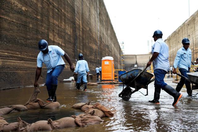 Panama Canal workers carry out routine maintenance inside one of the chambers at the Gatun Locks in the province of Colon, located about 80 kilometers north of Panama City, on June 15, 2026. These maintenance operations are carried out periodically across the interoceanic waterway to ensure the safe and efficient transit of vessels along one of the world's most important and heavily traveled maritime trade routes. (Photo by ARNULFO FRANCO / AFP)