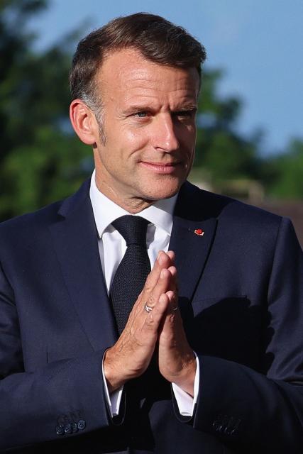 France's President Emmanuel Macron gestures during the official greeting as part of the G7 summit, in Evian, eastern France, on June 15, 2026. A G7 summit is set to take place June 15 to 17 in the French town of Evian-les-Bains near Switzerland and it will be attended by country leaders as well as the EU's foreign policy chief and ministers from Brazil, Canada, the United Arab Emirates and Turkey. (Photo by Ludovic MARIN / AFP)