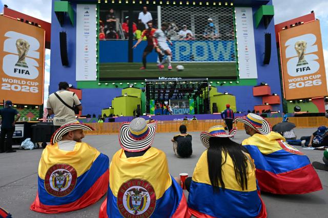 Fans of Colombia attend the screening of the 2026 World Cup football tournament Group G match between Belgium and Egypt at the FIFA Fan Festival at Zocalo square in Mexico City on June 15, 2026. (Photo by YURI CORTEZ / AFP)