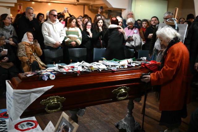 Estela de Carlotto (R), president of Abuelas de Plaza de Mayo, attends the wake of Taty Almeida, the late president of the Madres de Plaza de Mayo human rights association, at the telecommunications union office (FOETRA) in Buenos Aires on June 15, 2026. Almeida died on June 14, 2026 at the age of 95, after more than four decades as one of the most prominent voices against the crimes of Argentina's last dictatorship since she lost in 1975 her son Alejandro, a member of the guerrilla group Revolutionary People's Army (ERP), kidnapped by the right-wing paramilitary organization Triple A. (Photo by Luis ROBAYO / AFP)