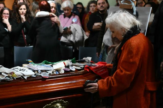 Estela de Carlotto (R), president of Abuelas de Plaza de Mayo, attends the wake of Taty Almeida, the late president of the Madres de Plaza de Mayo human rights association, at the telecommunications union office (FOETRA) in Buenos Aires on June 15, 2026. Almeida died on June 14, 2026 at the age of 95, after more than four decades as one of the most prominent voices against the crimes of Argentina's last dictatorship since she lost in 1975 her son Alejandro, a member of the guerrilla group Revolutionary People's Army (ERP), kidnapped by the right-wing paramilitary organization Triple A. (Photo by Luis ROBAYO / AFP)
