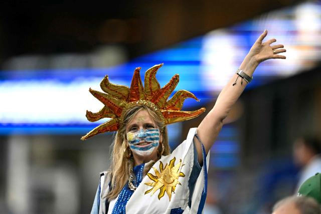 An Uruguayan fan cheers for his team before the 2026 World Cup Group H football match between Saudi Arabia and Uruguay at the Miami Stadium in Miami Gardens on June 15, 2026.  (Photo by CHANDAN KHANNA / AFP)