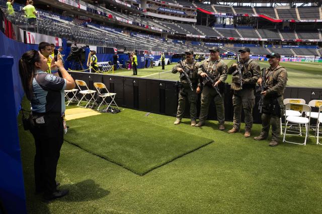 Inglewood police officers with the SWAT unit pose for a photo ahead of the 2026 World Cup Group G football match between Iran and New Zealand at the Los Angeles Stadium in Inglewood on June 15, 2026.  (Photo by ETIENNE LAURENT / AFP)
