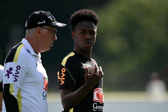 Brazil's forward #07 Vinicius Junior talks to Italian head coach Carlo Ancelotti during a training session at Columbia Park Training Facility in Morristown, New Jersey, on June 15, 2026, during the 2026 World Cup football tournament. (Photo by MAURO PIMENTEL / AFP)