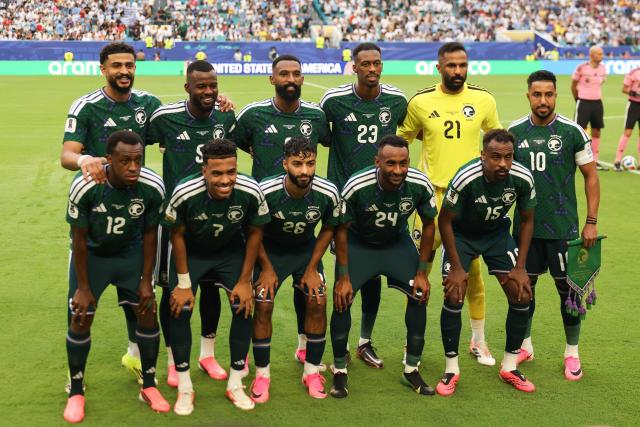 Saudi Arabia players pose for pictures ahead of the 2026 World Cup Group H football match between Saudi Arabia and Uruguay at the Miami Stadium in Miami Gardens on June 15, 2026.  (Photo by PATRICIA DE MELO MOREIRA / AFP)