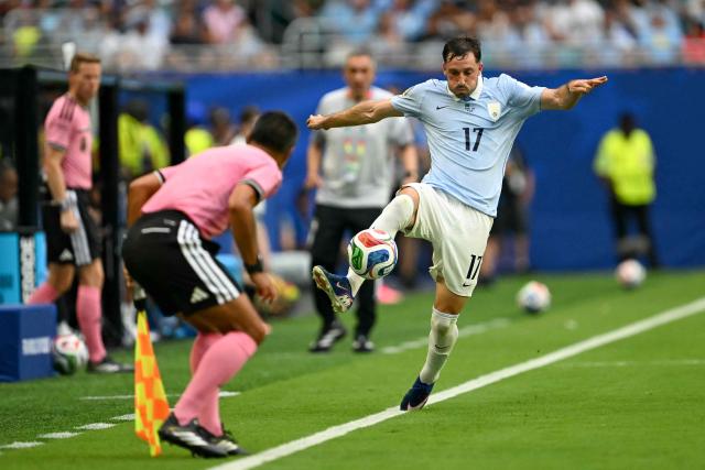 Uruguay's defender #17 Matias Vina controlsthe ball during the 2026 World Cup Group H football match between Saudi Arabia and Uruguay at the Miami Stadium in Miami Gardens on June 15, 2026.  (Photo by CHANDAN KHANNA / AFP)