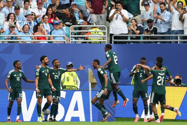 Saudi Arabia players celebrate after scoring their first goal during the 2026 World Cup Group H football match between Saudi Arabia and Uruguay at the Miami Stadium in Miami Gardens on June 15, 2026.  (Photo by PATRICIA DE MELO MOREIRA / AFP)
