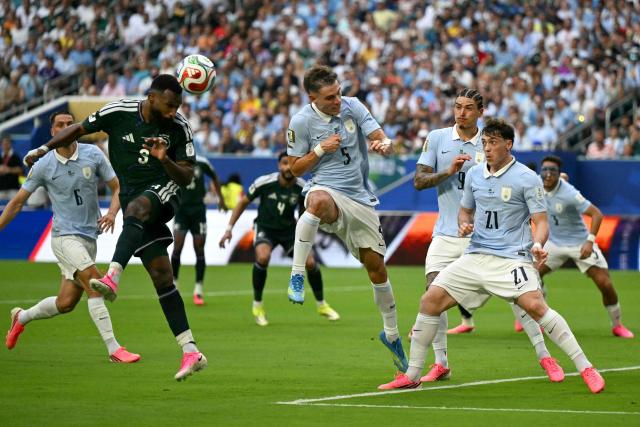 Saudi Arabia's defender #03 Ali Lajami heads the ball next to midfielder #05 Manuel Ugarte, Uruguay's forwards #09 Darwin Nunez and #21 Federico Vinas during the 2026 World Cup Group H football match between Saudi Arabia and Uruguay at the Miami Stadium in Miami Gardens on June 15, 2026.  (Photo by CHANDAN KHANNA / AFP)
