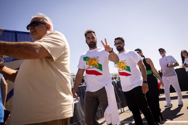 Iran fans wait in line to go through security at Los Angeles Stadium (SoFi Stadium) ahead of the 2026 World Cup Group G football match between Iran and New Zealand in Inglewood, California, on June 15, 2026. (Photo by ETIENNE LAURENT / AFP)