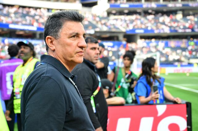 Iran's head coach Amir Ghalenoei looks on as he walks on the pitch ahead of the 2026 World Cup Group G football match between Iran and New Zealand at Los Angeles Stadium in Inglewood on June 15, 2026.  (Photo by Frederic J. Brown / AFP)