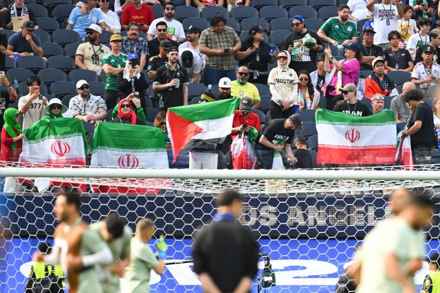 Iranian fans cheer for their team ahead of the 2026 World Cup Group G football match between Iran and New Zealand at Los Angeles Stadium in Inglewood on June 15, 2026.  (Photo by Patrick T. Fallon / AFP)