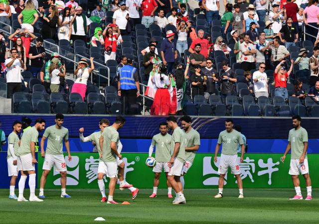 Iran's players warm up ahead of the 2026 World Cup Group G football match between Iran and New Zealand at Los Angeles Stadium in Inglewood on June 15, 2026.  (Photo by Frederic J. Brown / AFP)
