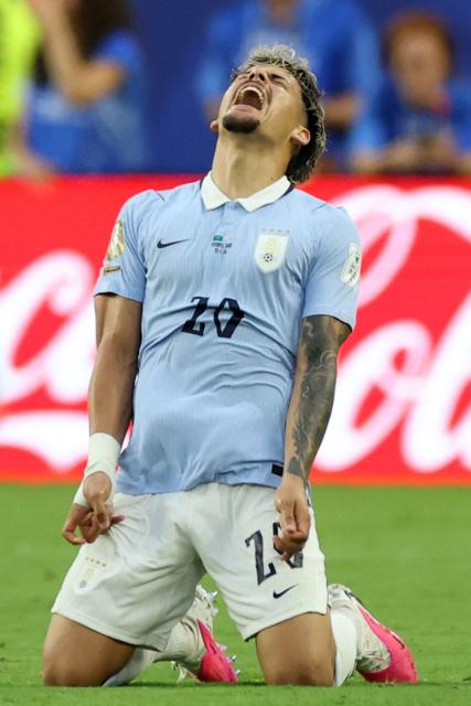 Uruguay's midfielder #20 Maximiliano Araujo celebrates after scoring the equalising goal during the 2026 World Cup Group H football match between Saudi Arabia and Uruguay at the Miami Stadium in Miami Gardens on June 15, 2026.  (Photo by PATRICIA DE MELO MOREIRA / AFP)