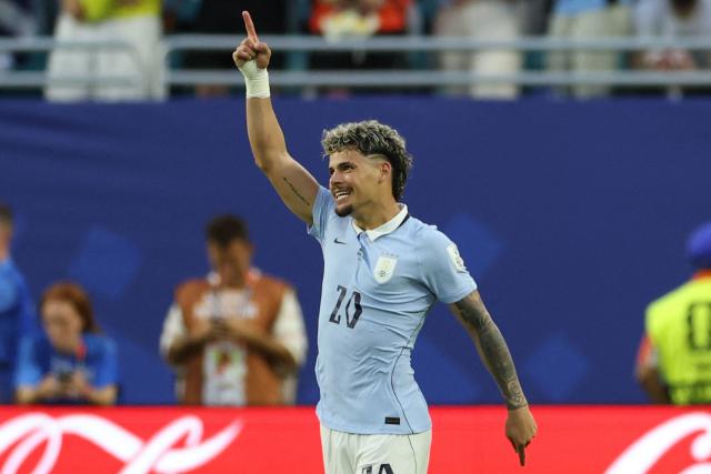 Uruguay's midfielder #20 Maximiliano Araujo celebrates after scoring the equalising goal during the 2026 World Cup Group H football match between Saudi Arabia and Uruguay at the Miami Stadium in Miami Gardens on June 15, 2026.  (Photo by PATRICIA DE MELO MOREIRA / AFP)
