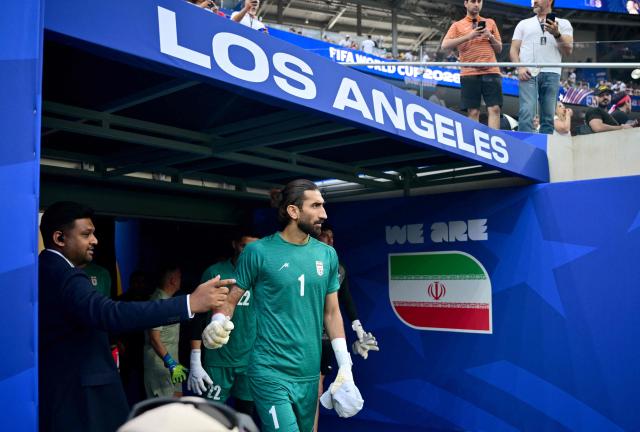 Iran's goalkeeper #01 Alireza Beiranvand walks onto the pitch to warm up ahead of the 2026 World Cup Group G football match between Iran and New Zealand at Los Angeles Stadium in Inglewood on June 15, 2026.  (Photo by Frederic J. Brown / AFP)