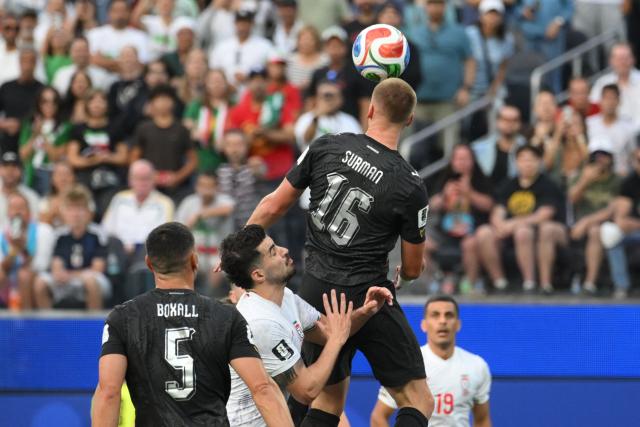 New Zealand's defender #16 Finn Surman heads the ball during the 2026 World Cup Group G football match between Iran and New Zealand at Los Angeles Stadium in Inglewood on June 15, 2026.  (Photo by Patrick T. Fallon / AFP)