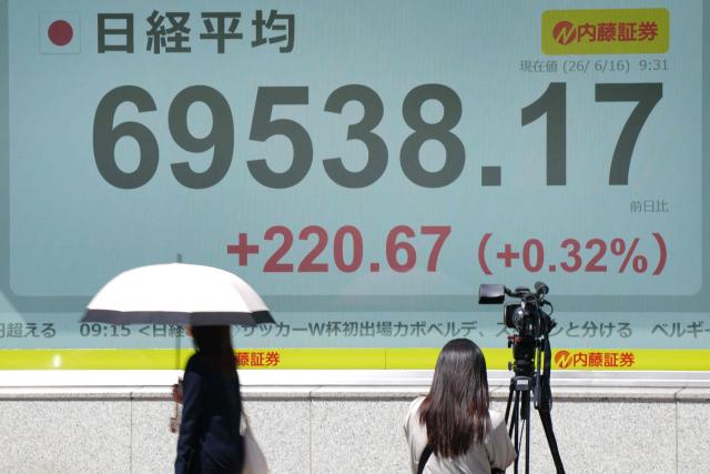 An electronic quotation board displays the Nikkei Stock Average on the Tokyo Stock Exchange in Tokyo on June 16, 2026. (Photo by Kazuhiro NOGI / AFP)