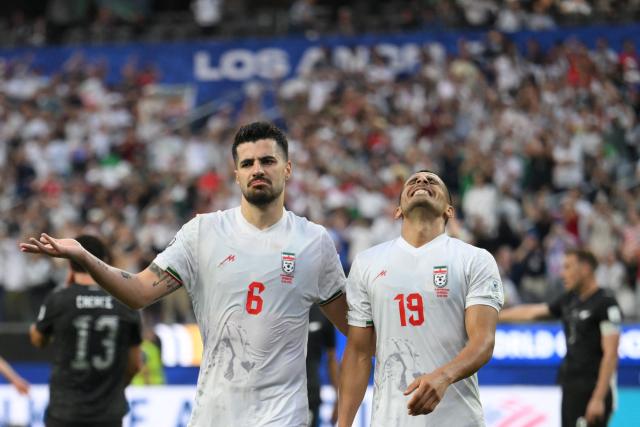Iran's defender #19 Ali Nemati (R) reacts after a goal which was later disallowed for offside during the 2026 World Cup Group G football match between Iran and New Zealand at Los Angeles Stadium in Inglewood on June 15, 2026.  (Photo by Patrick T. Fallon / AFP)