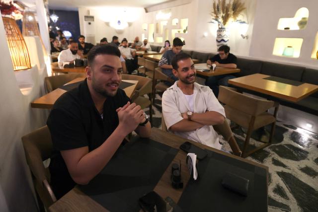 Iranians watch the 2026 World Cup football tournament match between Iran and New Zealand at a cafe in Tehran, Iran, on June 16, 2026. (Photo by ATTA KENARE / AFP) / Israel OUT/NO Access Israel Media/Persian Language TV Stations Outside Iran/Strictly No Access BBC Persian/VOA Persian/Manoto TV/Iran International TV