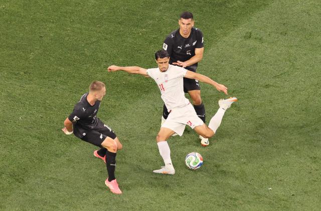 Iran's forward #11 Ali Alipour kicks the ball during the 2026 World Cup Group G football match between Iran and New Zealand at Los Angeles Stadium in Inglewood on June 15, 2026.  (Photo by Etienne Laurent / AFP)
