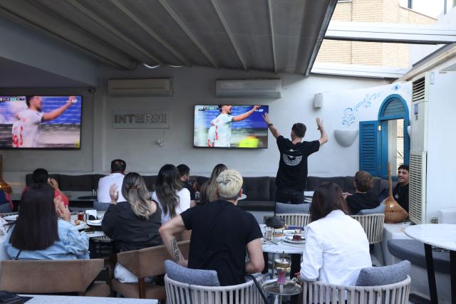 Iranians watch the 2026 World Cup football tournament match between Iran and New Zealand at a cafe in Tehran, Iran, on June 16, 2026. (Photo by ATTA KENARE / AFP) / Israel OUT/NO Access Israel Media/Persian Language TV Stations Outside Iran/Strictly No Access BBC Persian/VOA Persian/Manoto TV/Iran International TV